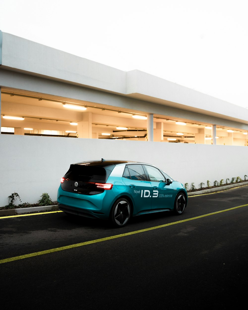 blue 5 door hatchback on road