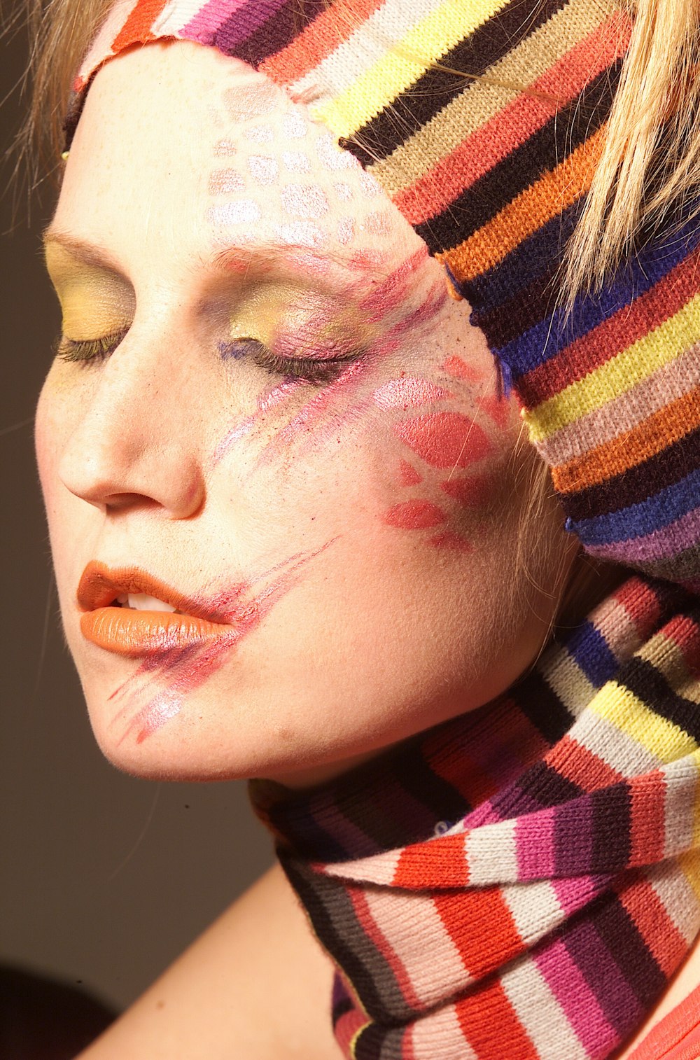 woman with red white and black face paint