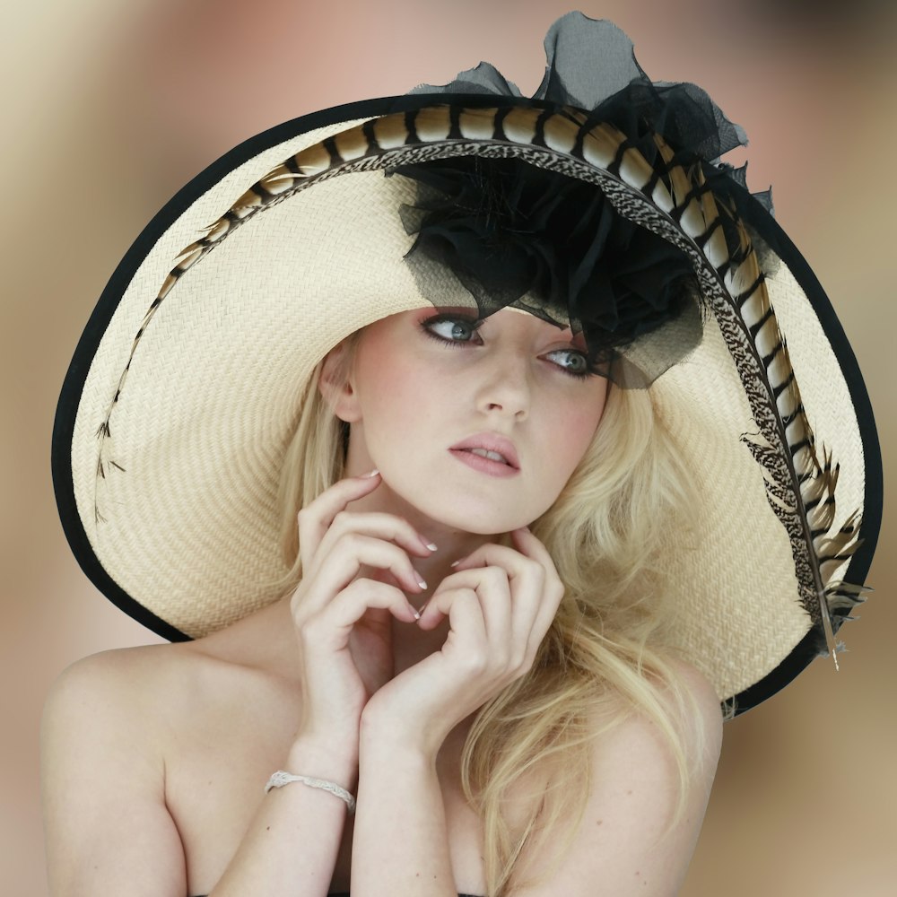 woman wearing white and black sun hat