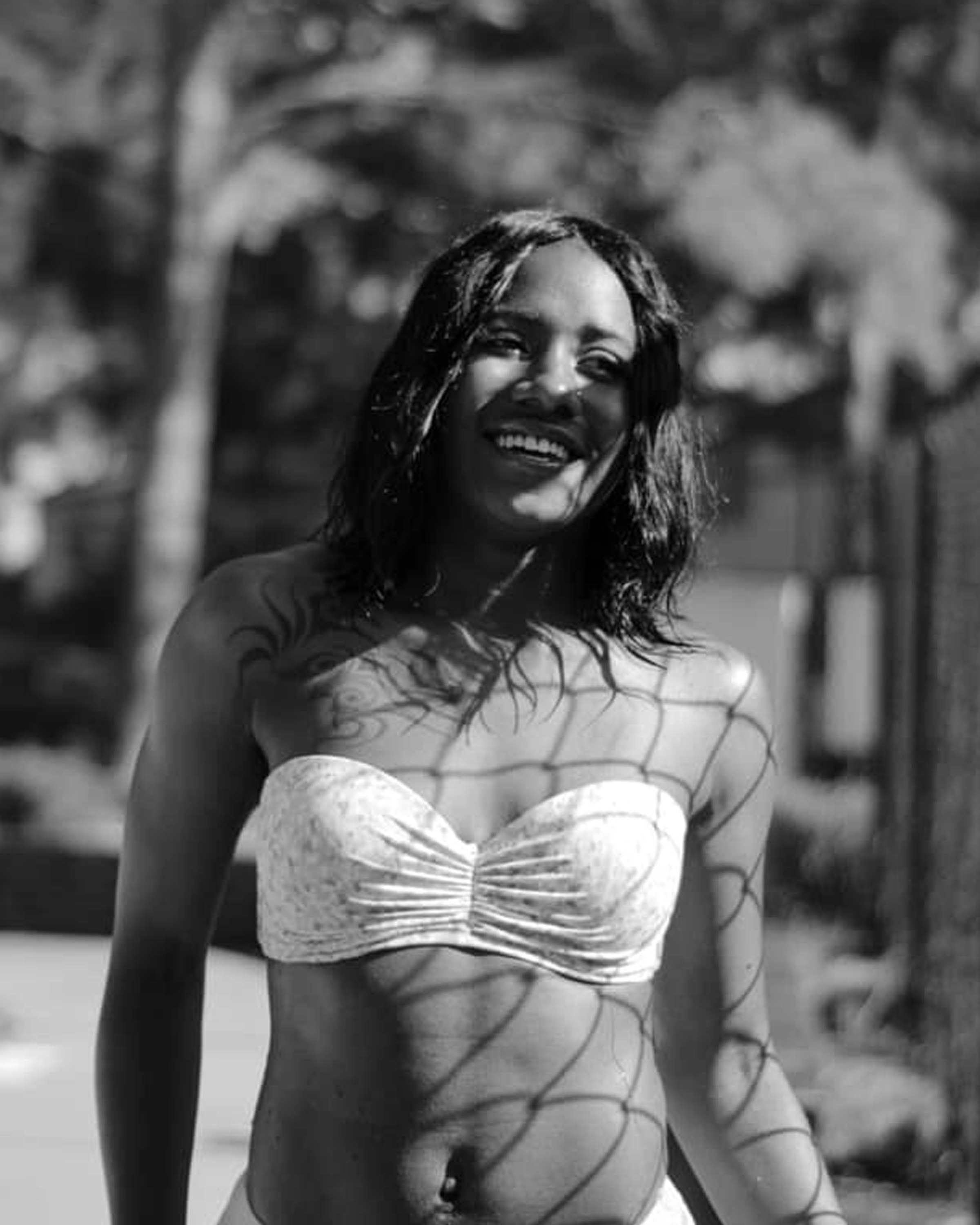 grayscale photo of woman in white bikini top