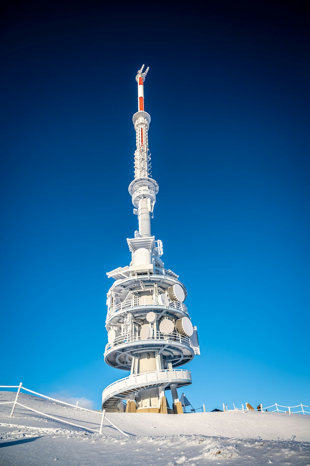 white and red tower under blue sky during daytime