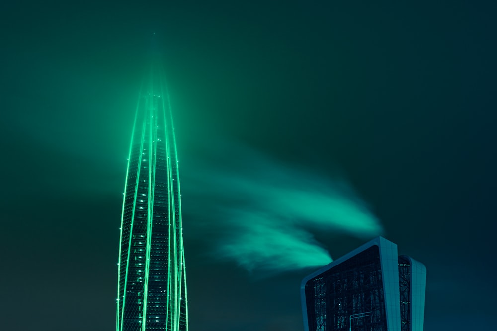 blue and black high rise building during night time