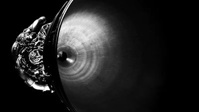 Close-up of a rocket engine with intricate details and glowing thrusters.