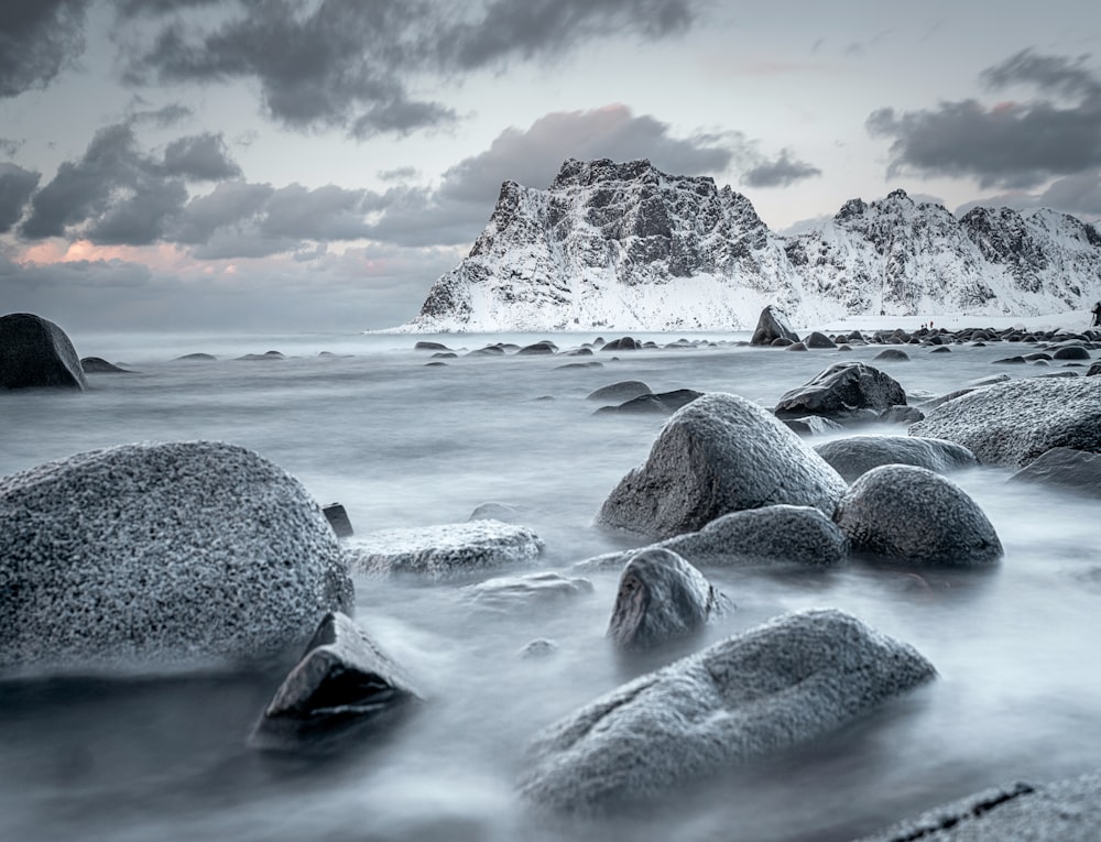 gray scale photo of rocky shore