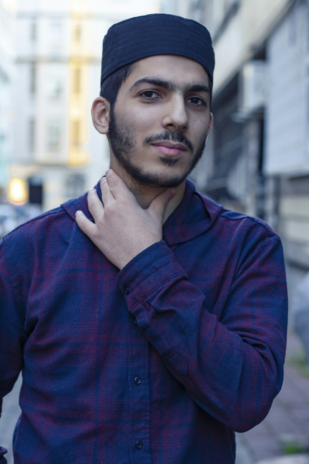 man in red and blue plaid dress shirt