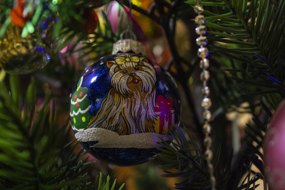 blue and gold bauble on christmas tree