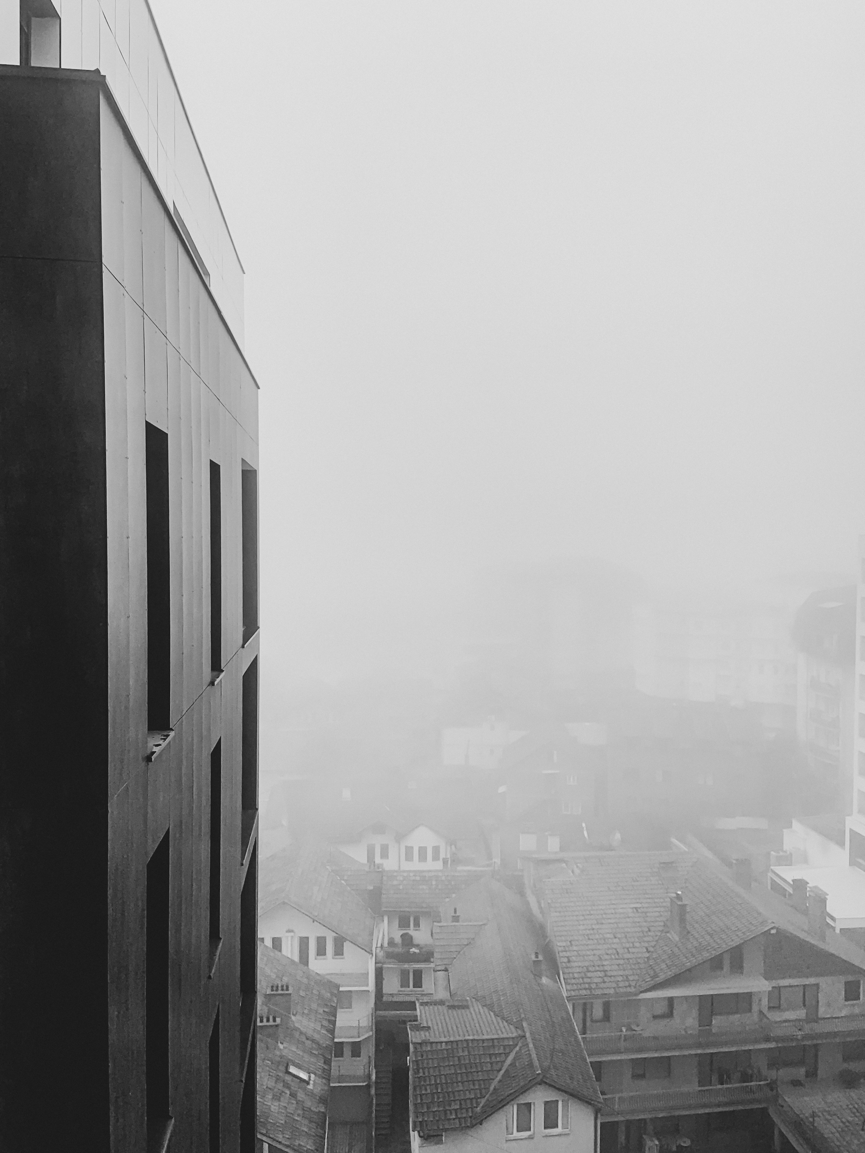 grayscale photo of city buildings