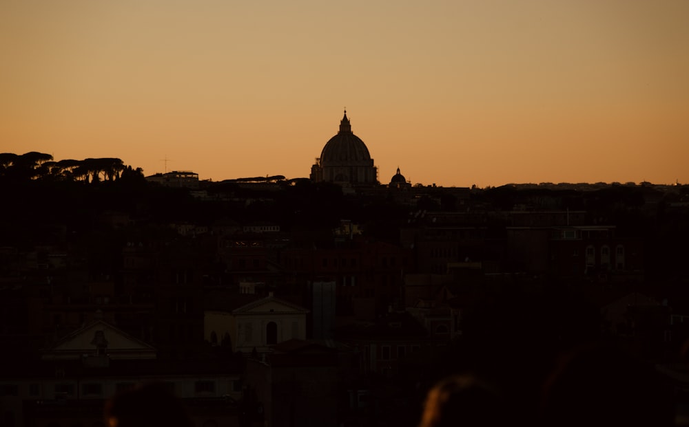 silhouette of building during sunset