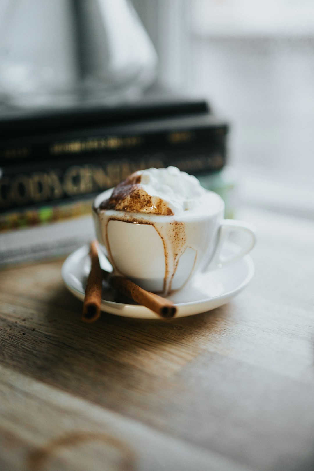 white ceramic teacup with saucer on brown wooden table