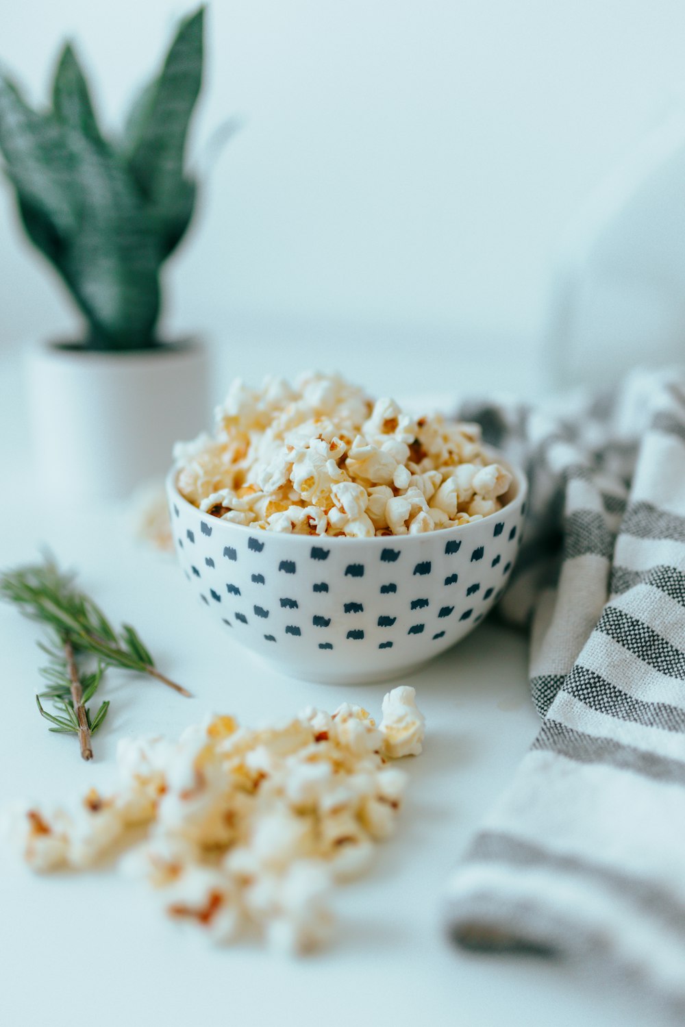 white ceramic bowl with popcorn