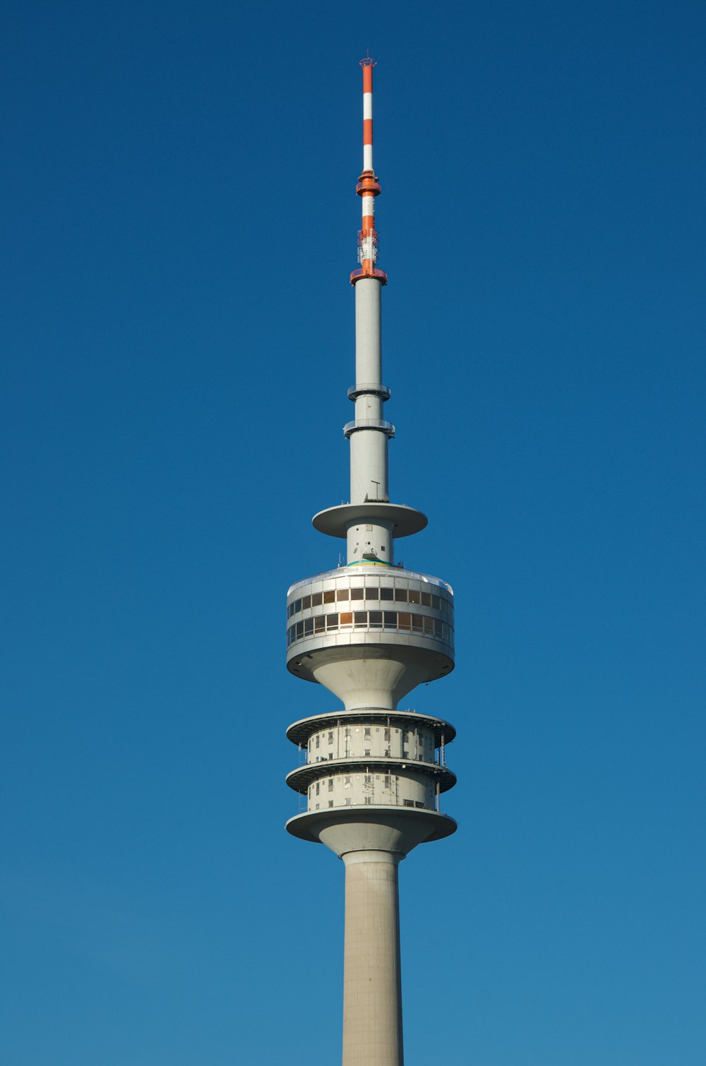 white and red tower under blue sky during daytime