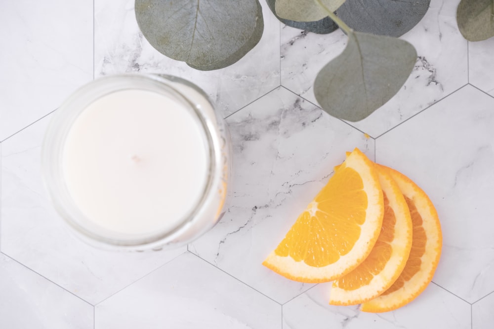 sliced orange fruit on white round plate