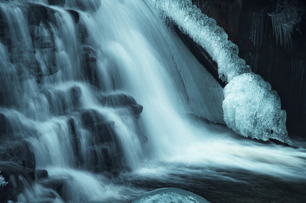 white and gray stone on waterfalls