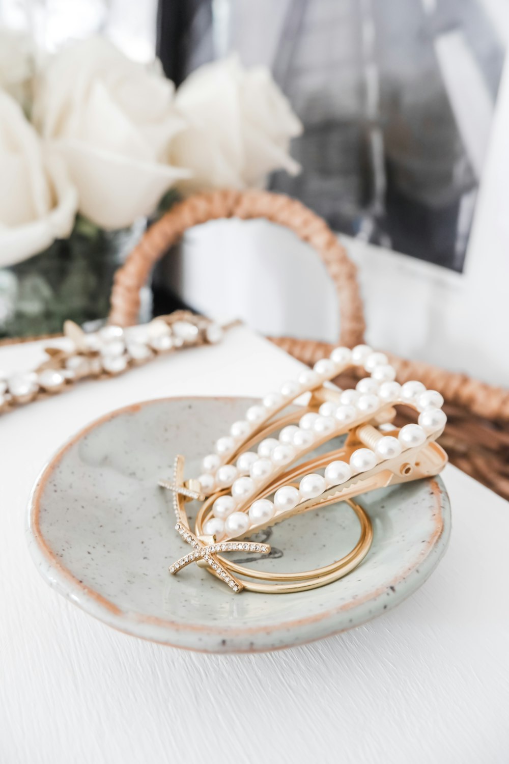 gold necklace on white ceramic plate
