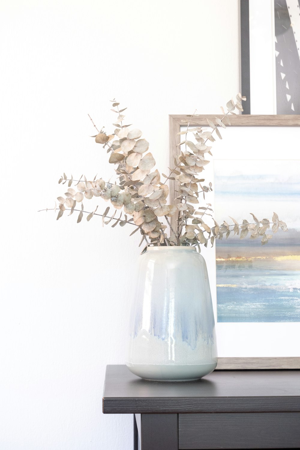 white flowers in white ceramic vase