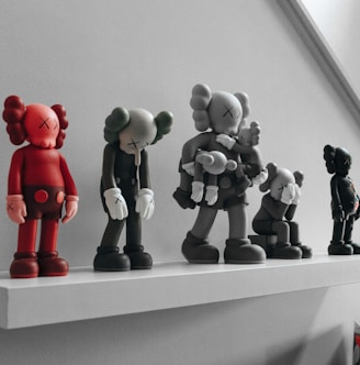 red and gray elephant figurines