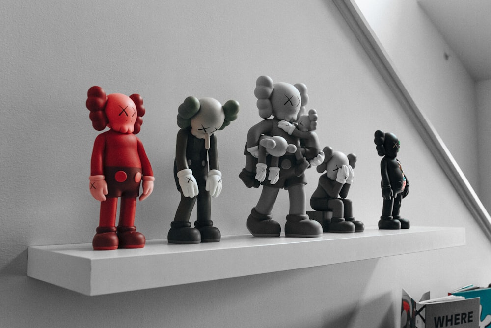 red and gray elephant figurines