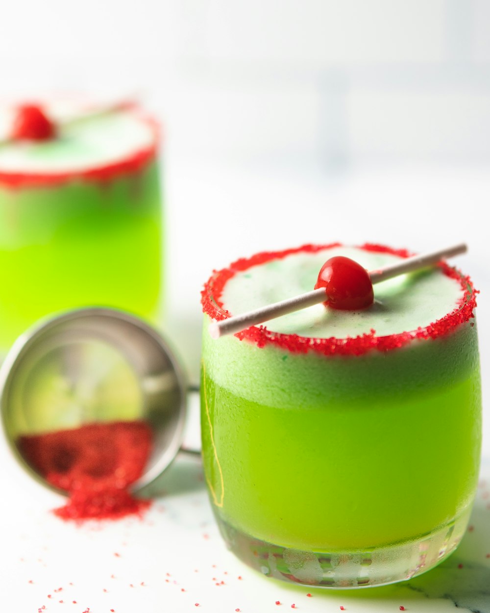 green liquid in clear drinking glass