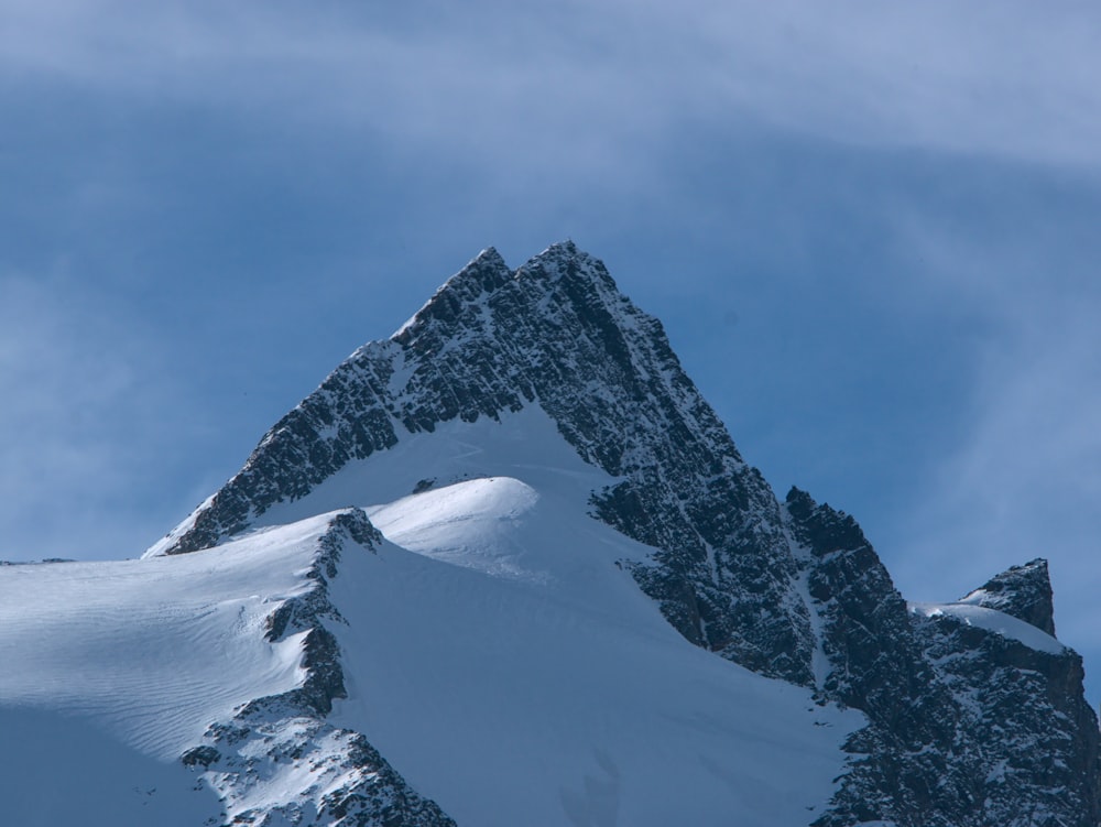 snow covered mountain under blue sky during daytime