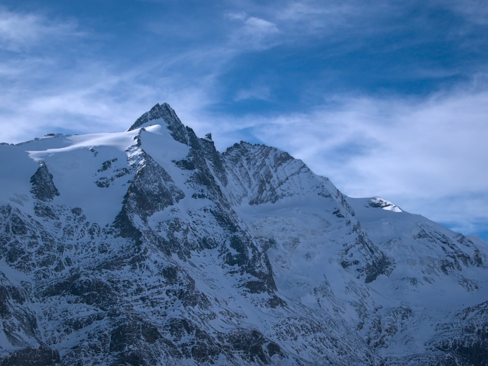 snow covered mountain under blue sky during daytime