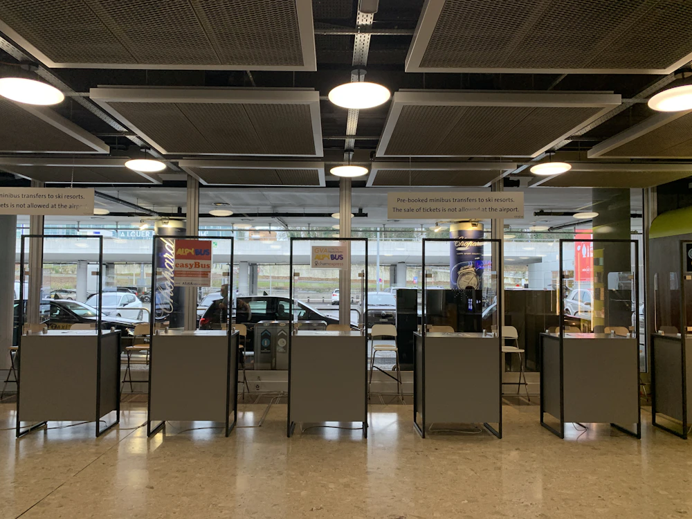 Modern airport car rental counter with multiple service windows