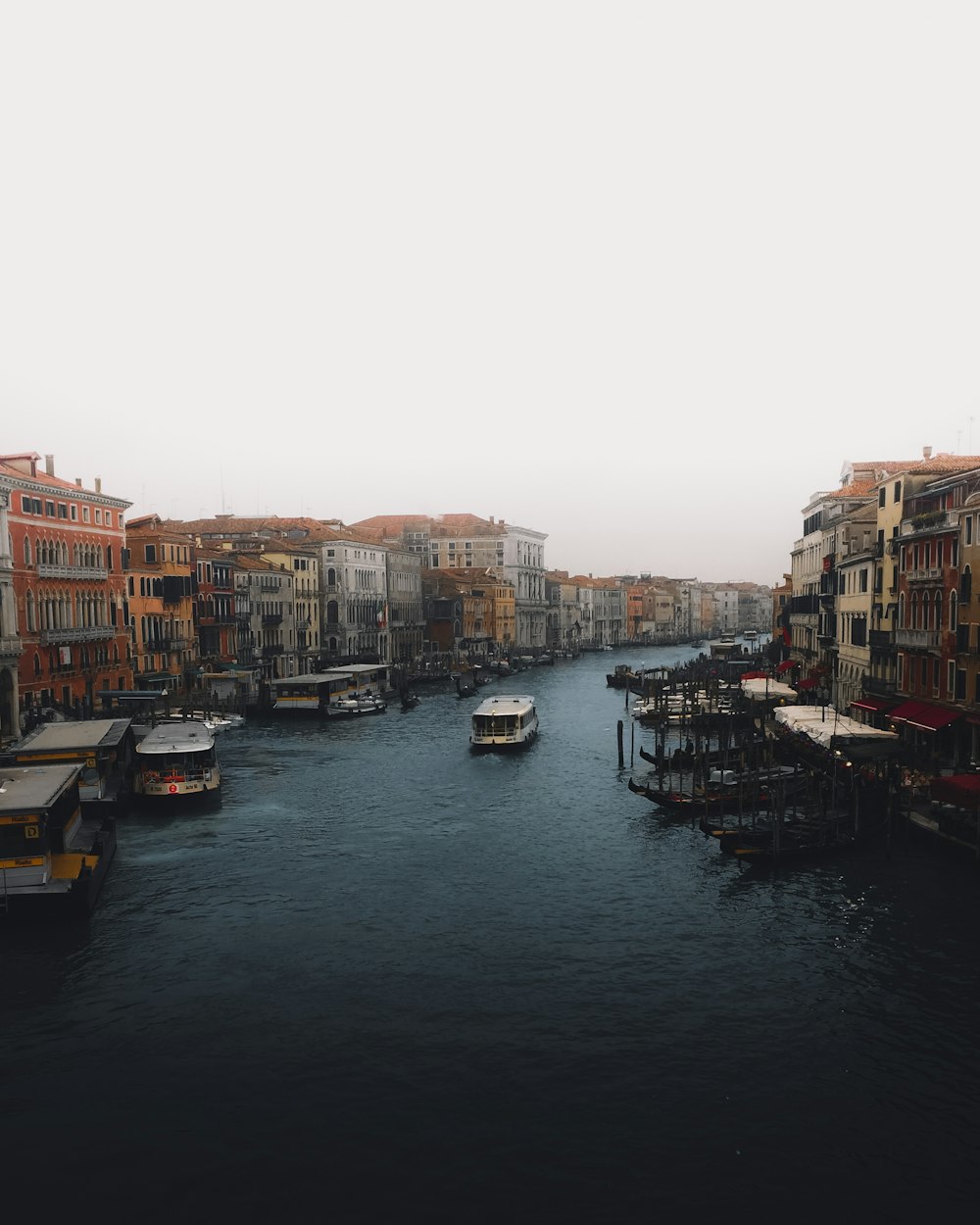 boat on water near buildings during daytime