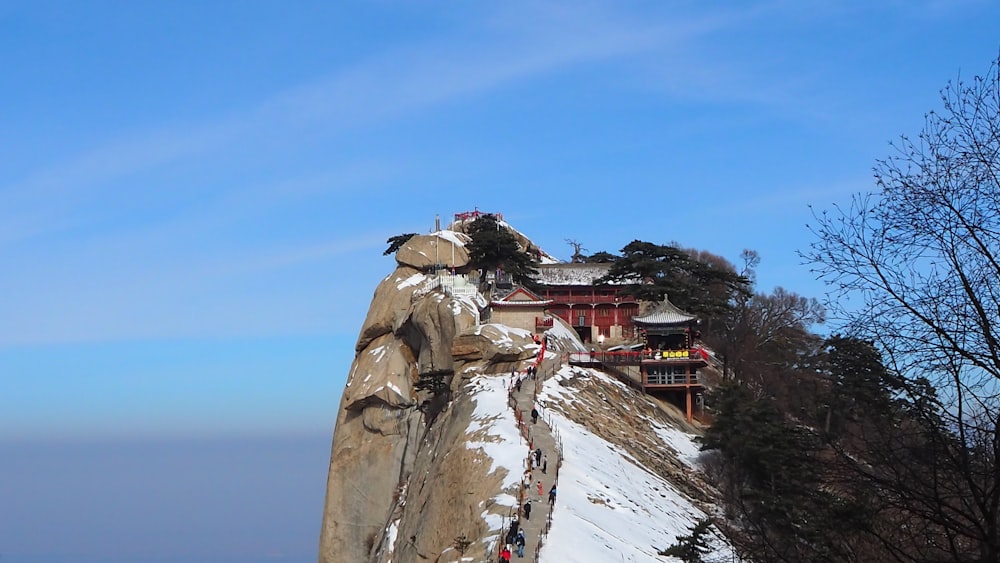 brown and white house on top of mountain during daytime