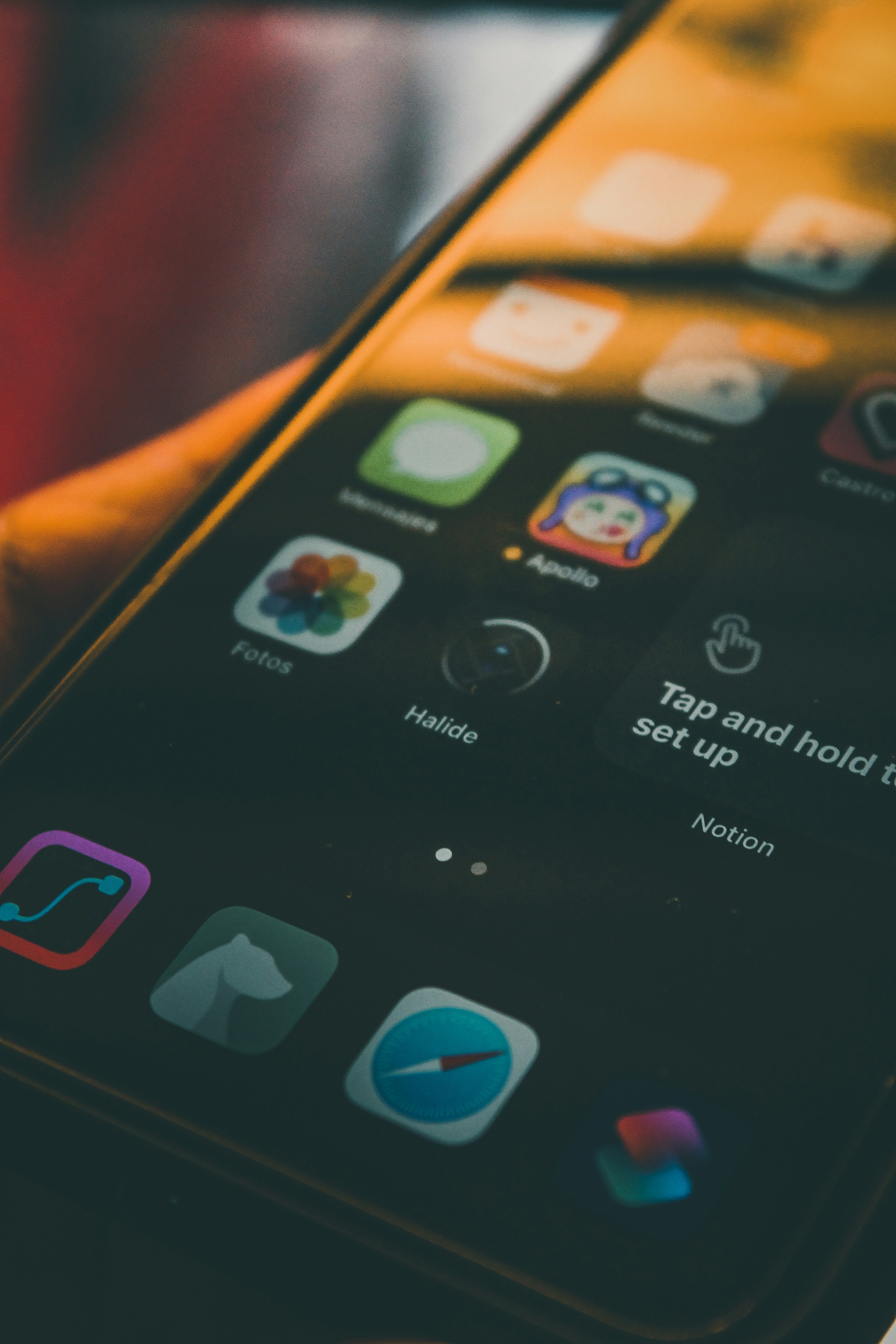 black iphone 4 turned on displaying icons