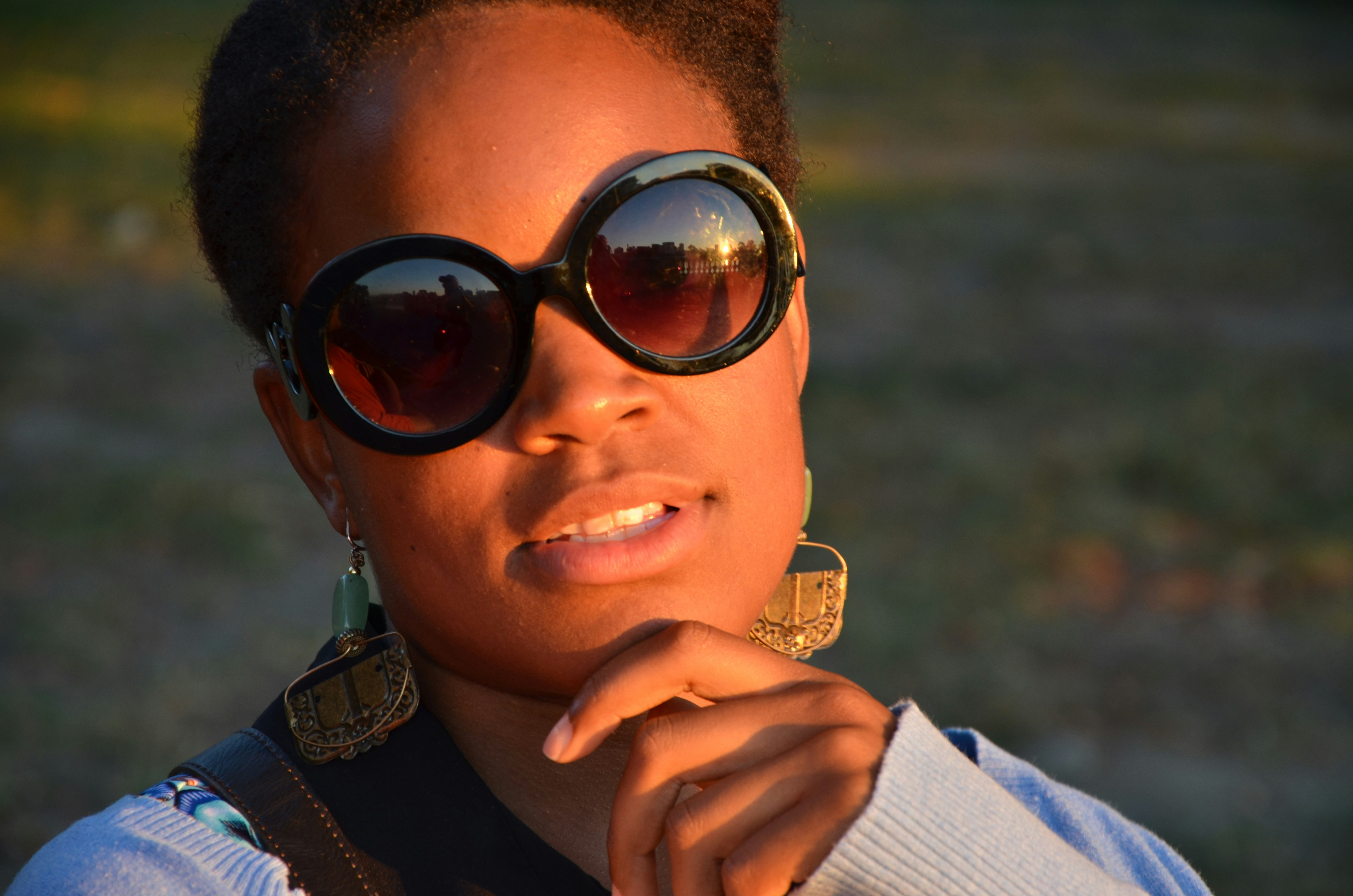 woman in black sunglasses and white long sleeve shirt