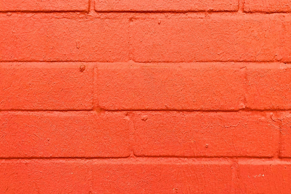 red brick wall during daytime