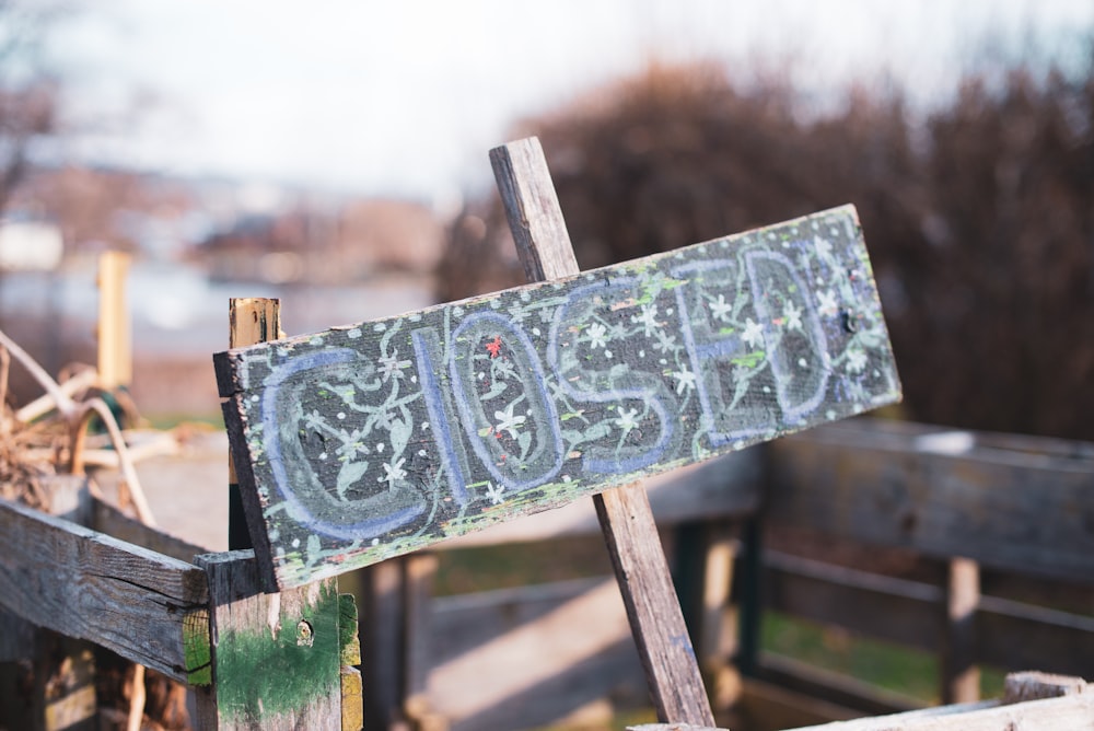 gray wooden cross with cross