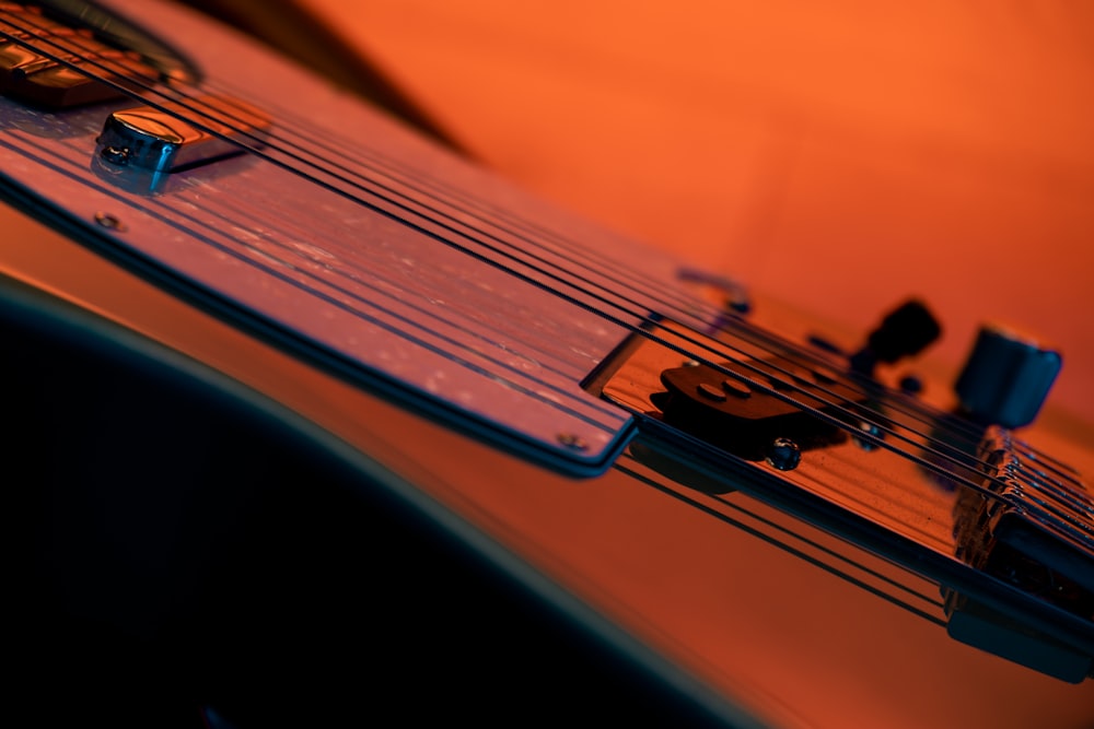 orange and black guitar pick