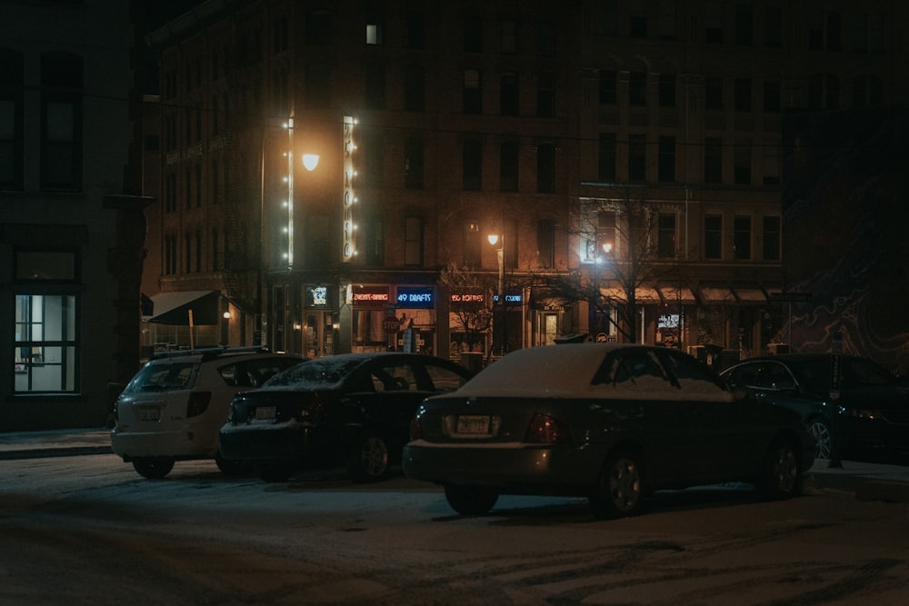 cars parked on side of the road during night time