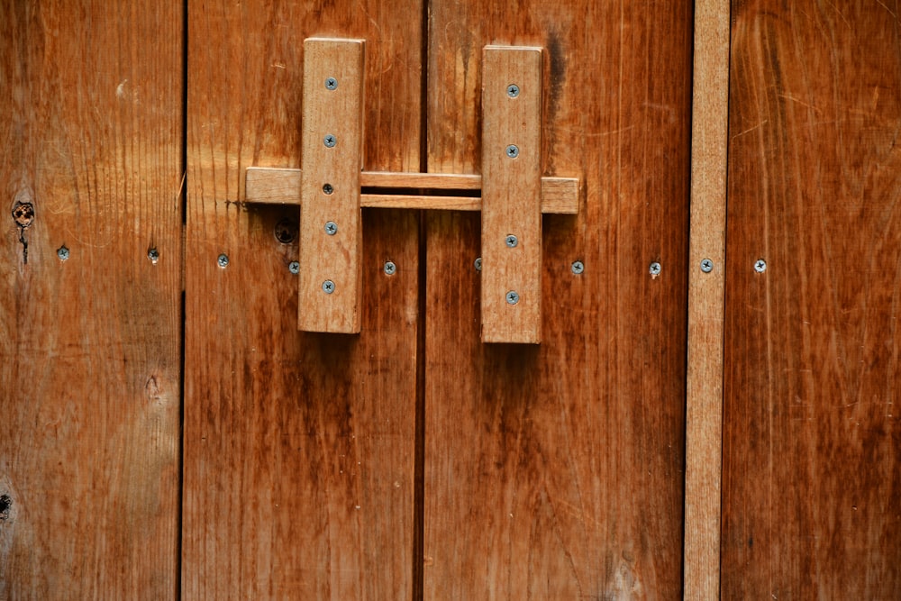 brown wooden door with silver door lever