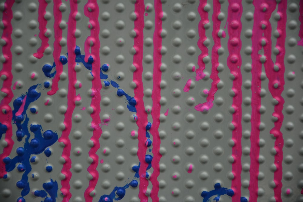 blue beads on pink plastic container