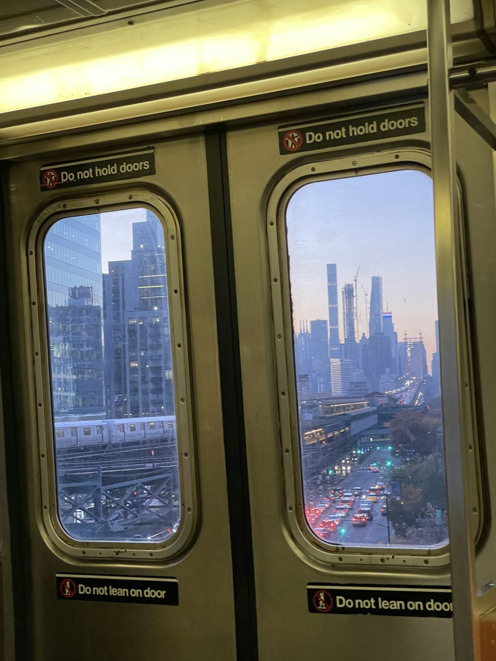 a view of a city from inside a train