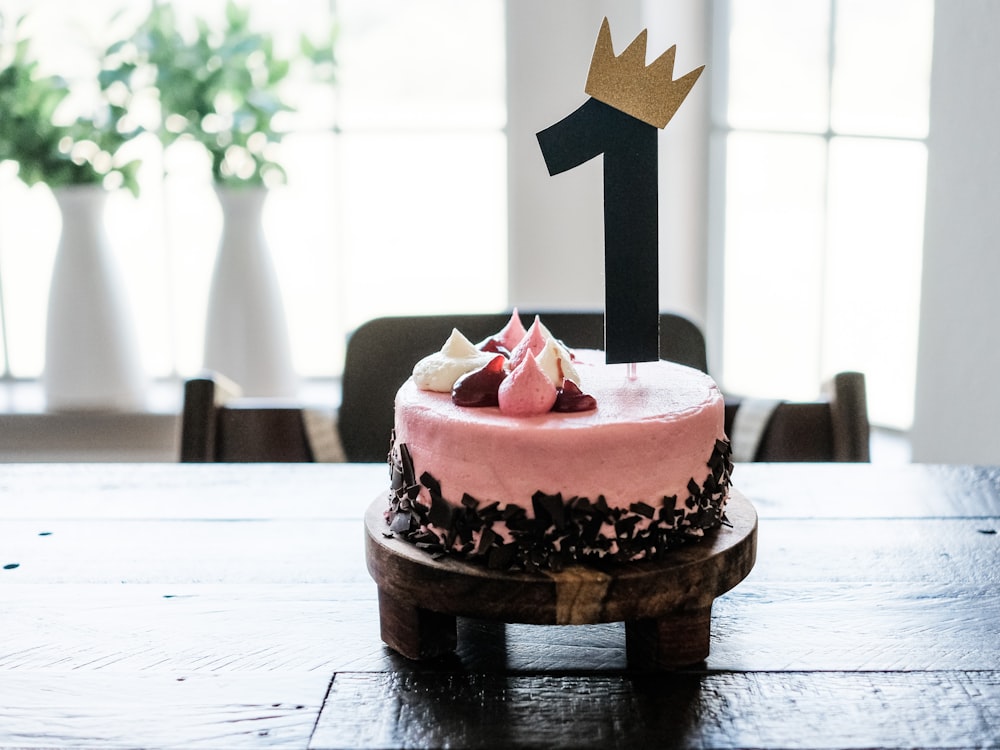 pink and brown cake on brown wooden table
