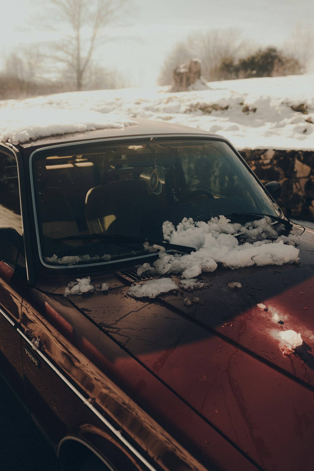 red car with snow on top