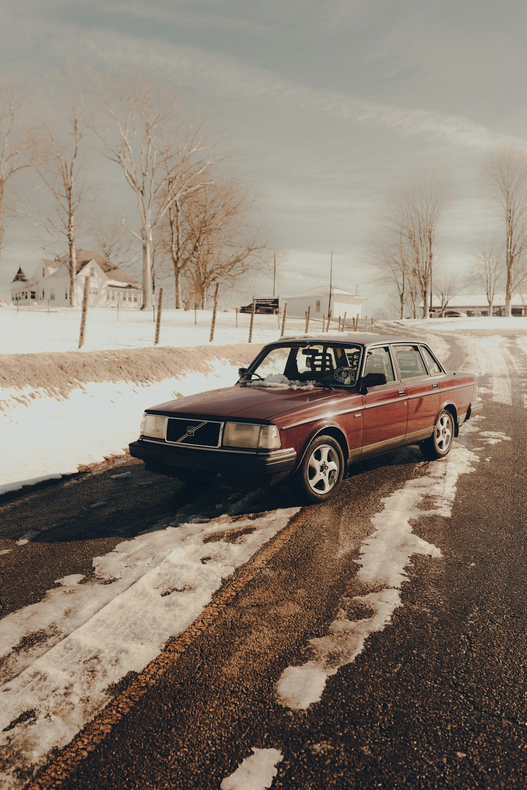 brown station wagon on snow covered ground during daytime