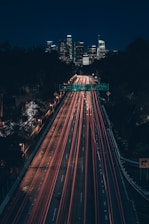 time lapse photography of cars on road during night time