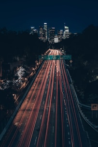 time lapse photography of cars on road during night time