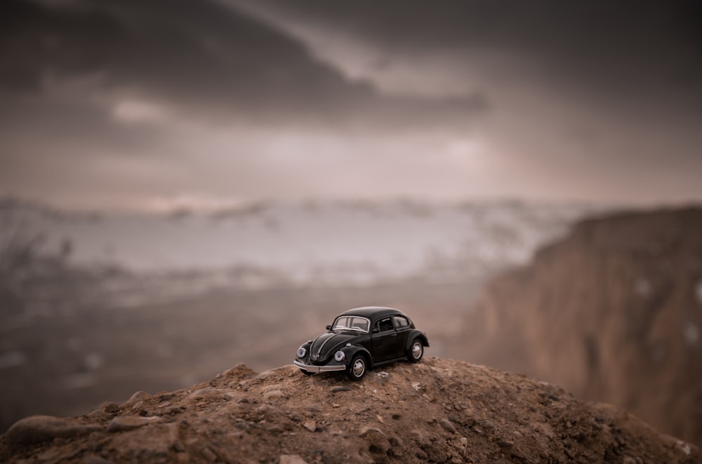 black suv on brown rock mountain during daytime