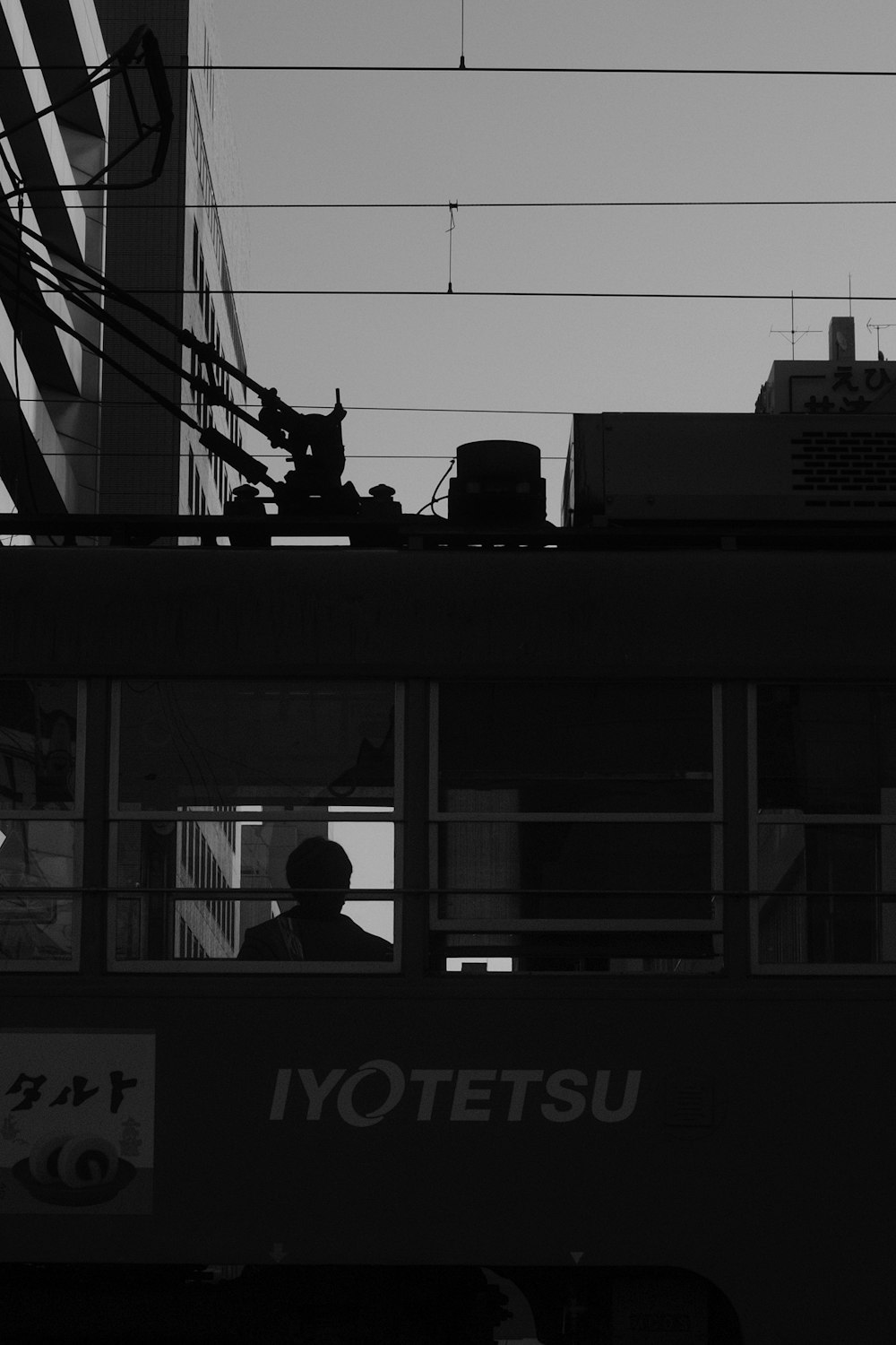 silhouette of people riding on train