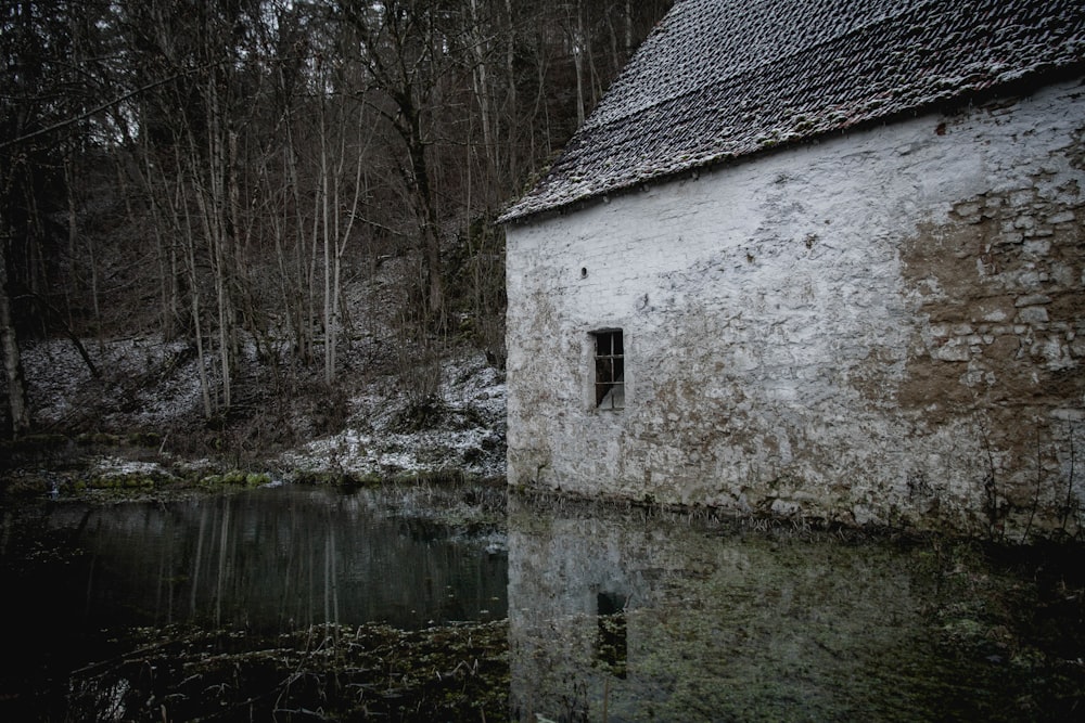 white concrete house near river