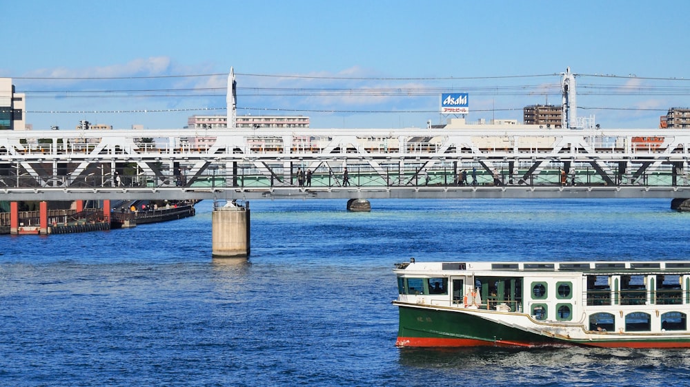 red and white boat on water during daytime