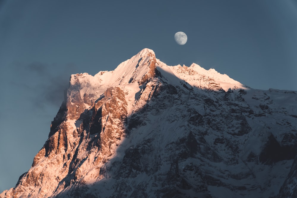 snow covered mountain under blue sky during daytime