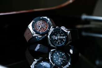 silver and black chronograph watch