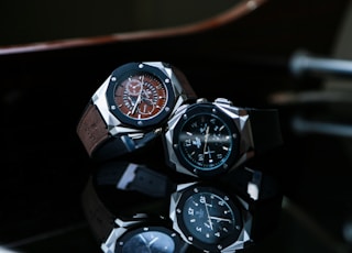 silver and black chronograph watch