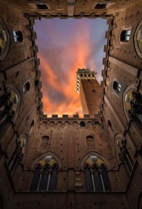brown concrete castle under cloudy sky