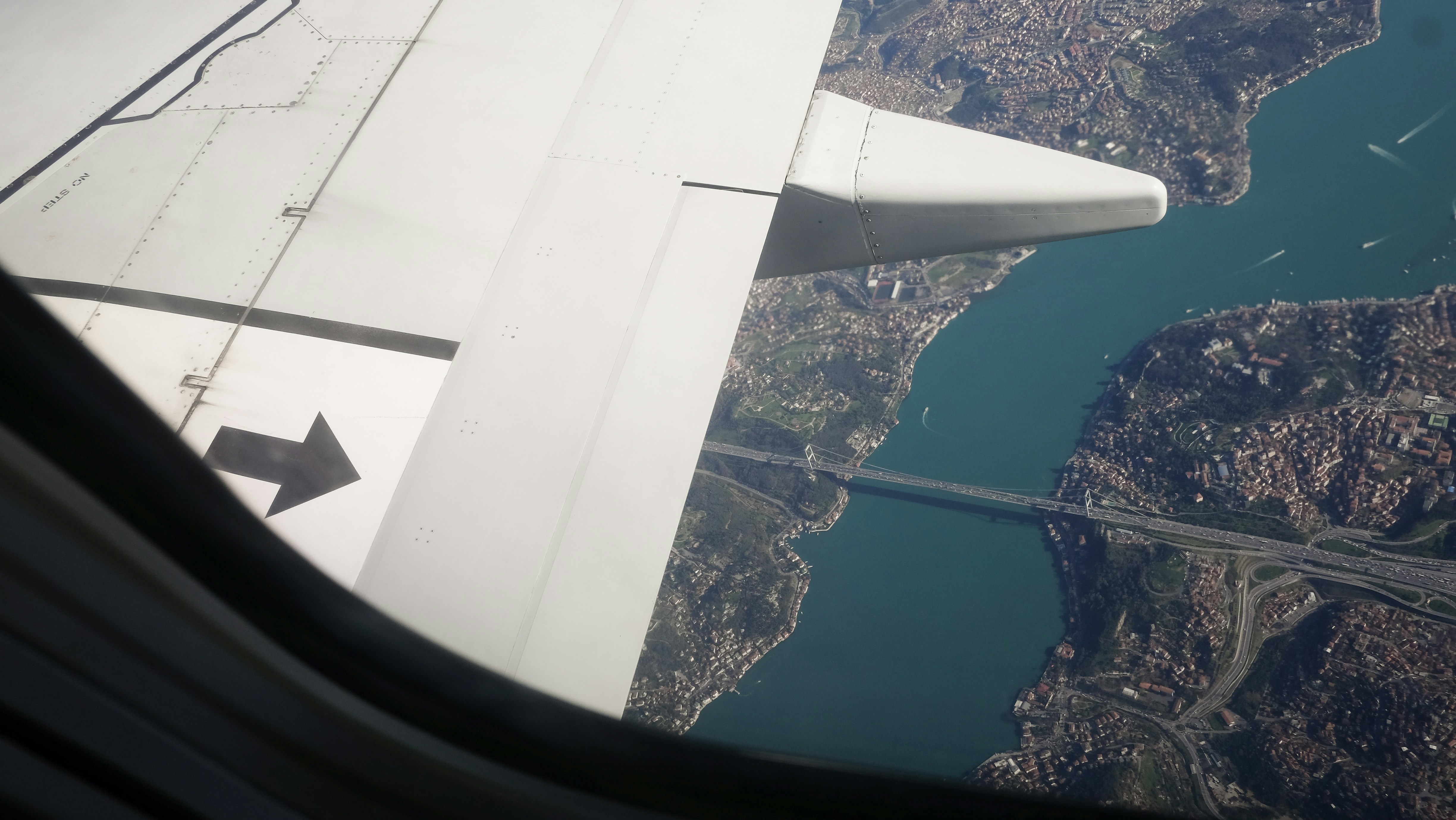 airplane window view of city during daytime, The bosphorus in Istanbul seen from above.